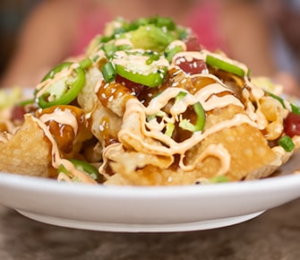 Poke Nachos - wonton chips, ahi tuna, sesame poke dressing, jalapeño